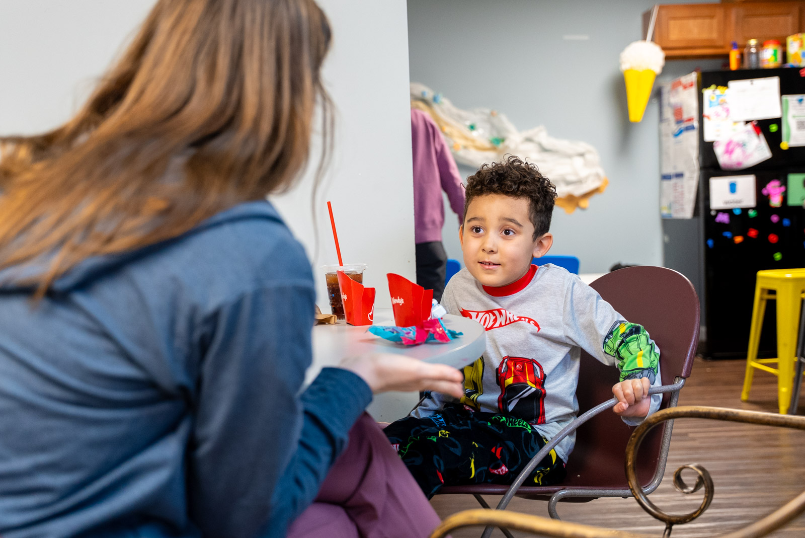 Therapist working with a child at a table